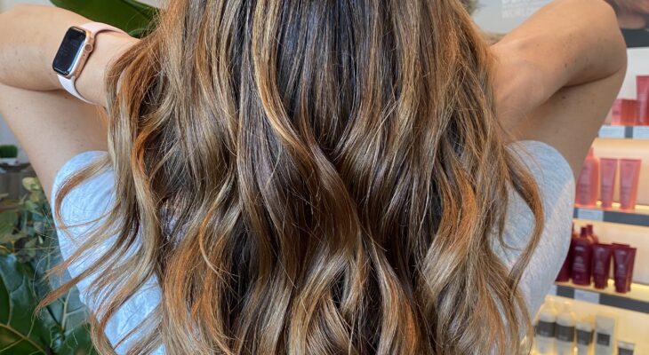 Woman with curly brown hair