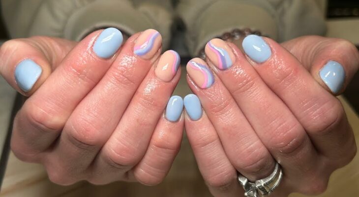 Close up of fingernails painted various colors